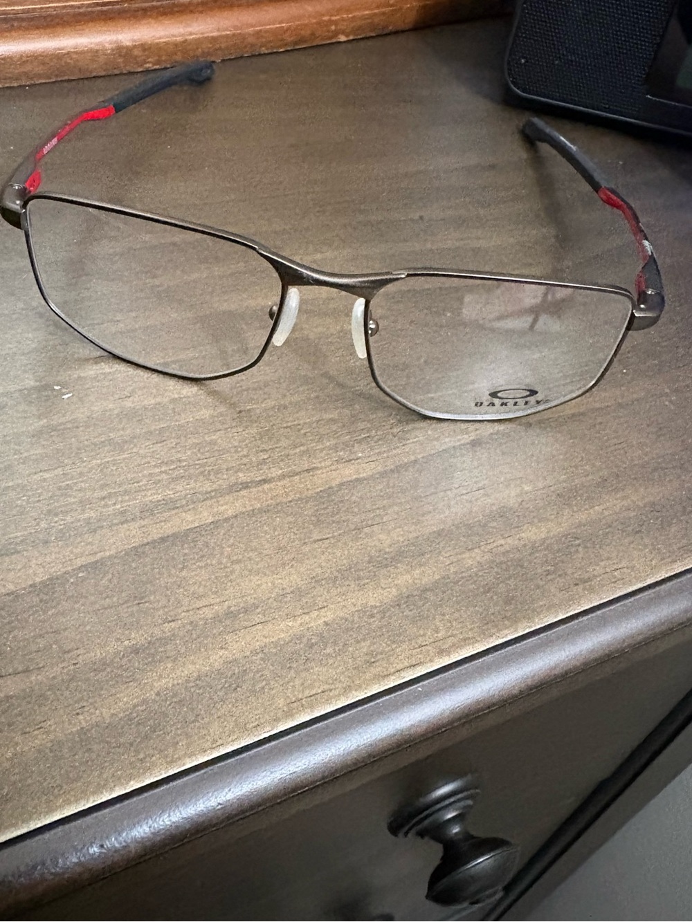 Oakley Men's Metal Frame Glasses in Gunmetal with Red Temples